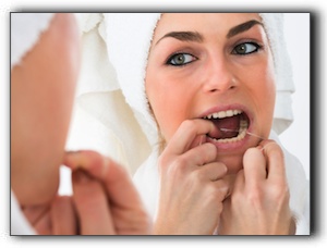 If My Gums Bleed, Should I Stop Flossing?